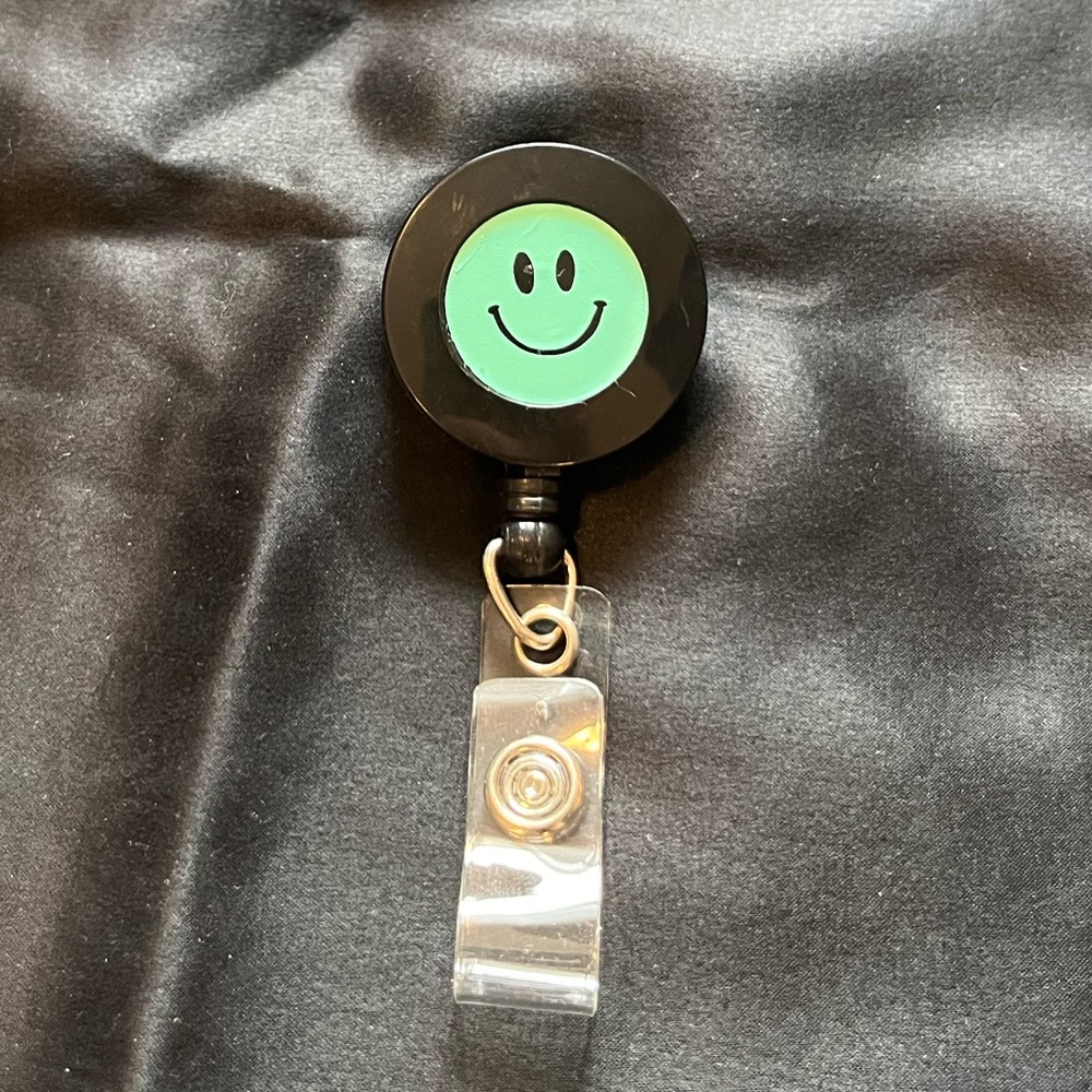 Black Badge Reel with Smiley Face